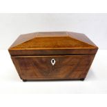 A 19th century inlaid mahogany tea caddy of sarcophagus form with two-section lidded interior,