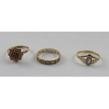 Three 9ct yellow gold rings, one set with chipped diamonds, size Q 1/2,