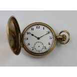 A gold plated keyless wind full hunter pocket watch with Dennison case.