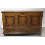 A 19th century panelled oak mule chest with two base drawers, width 136cm.