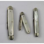 A hallmarked silver and mother of pearl fruit knife and two further plated examples (3).