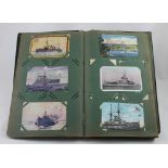 A large postcard album to include war, exhibitions, trains, embroidered cards, full.