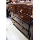 A Georgian mahogany straight-front chest of two short over three long drawers,