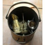 A quantity of assorted brassware to include teapot, trivet, fire irons etc.
