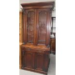 A 19th century mahogany display cabinet with two glazed doors enclosing three adjustable shelves on