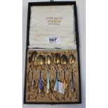 A George V cased set of six enamelled hallmarked silver teaspoons, HIH, import mark London 1923.