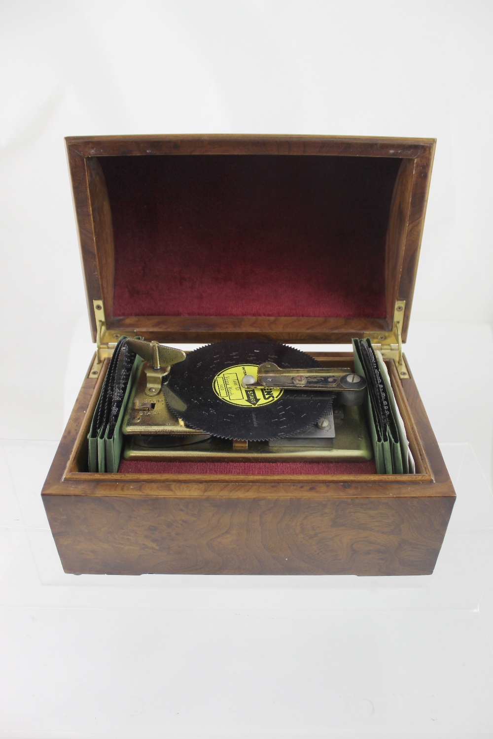 A late 20th century Swiss disc music box, walnut dome top case, together with six Thorens discs.