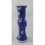 A Chinese blue and white Gu vase decorated in the prunus pattern,