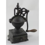 Peugeot & Co; a French iron coffee grinder with single base drawer, height 33cm.