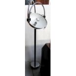 A mid-20th century chrome and black metal standard lamp with double arch articulated extending