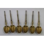 A set of six Edward VIII hallmarked silver gilt teaspoons, each with cast handles and chased bowls,
