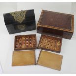 Four boxes including two mahogany slide open boxes with forty-four numbered small lidded