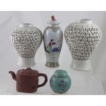 A group of Chinese ceramics comprising a near pair of blanc de Chine reticulated baluster vases