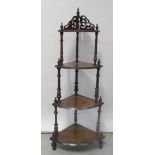 An Edwardian walnut corner four-tier whatnot, height 142cm (af) and a folding towel rail (2).