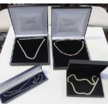 Four single-strand cultured pearl necklaces to include two examples with 18ct white gold clasps,