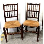 A set of four Lancashire-style spindle-back rush seat chairs (4).