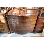 A 19th century crossbanded mahogany serpentine-fronted chest of four drawers,