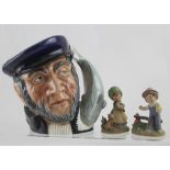 A Royal Doulton character jug D6500 'Capt. Ahab' and two Hummel-style figures (3).