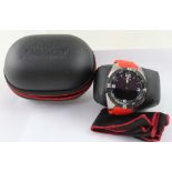 A Tissot solar powered titanium T Touch wristwatch on red rubber strap,