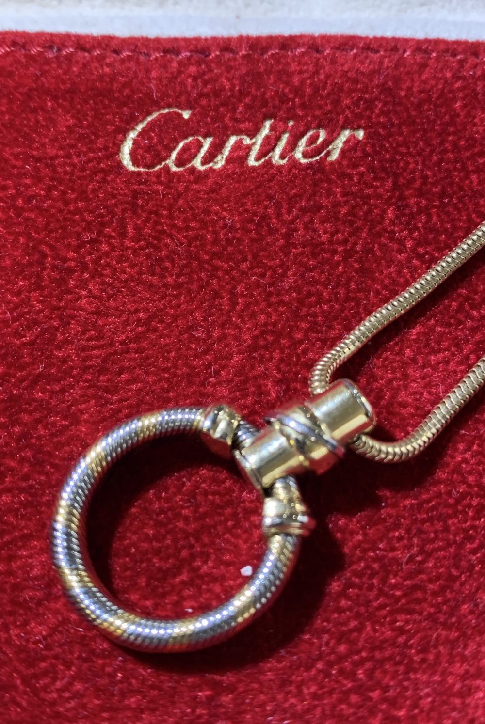 CARTIER; an 18ct two tone yellow and white gold hoop pendant suspended on a snake link 18ct yellow - Image 3 of 6