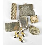 A silver scent bottle with wrythen moulded body, a small silver mesh purse, silver vesta case, a