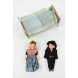 Two small German porcelain headed folk dolls dressed in traditional costume approx 14cm also a