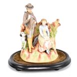 A 19th century Continental hand painted bisque porcelain figure group depicting a gunman or