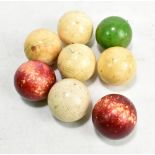 A collection of eight predominantly crystalline billiard balls, diameter approx 5cm (8).