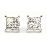 A pair of 18ct white gold and diamond ear studs, each with four princess cut stones and butterfly
