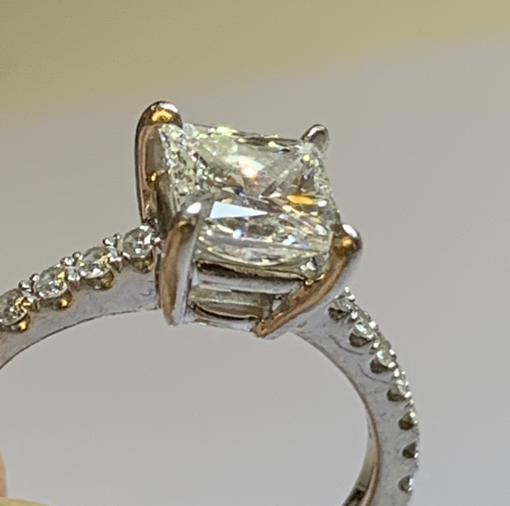 A platinum and diamond solitaire ring with central princess cut diamond weighing 1.52cts, with - Image 3 of 5