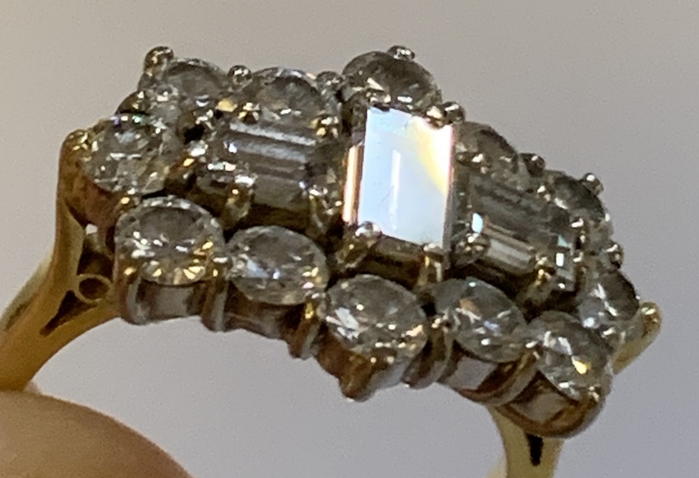 An 18ct yellow gold and diamond cluster ring, centred with three baguette cut stones within a border - Image 4 of 4
