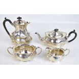 FENTON BROS LTD; an Edward VII hallmarked silver four piece tea set of shaped outline comprising