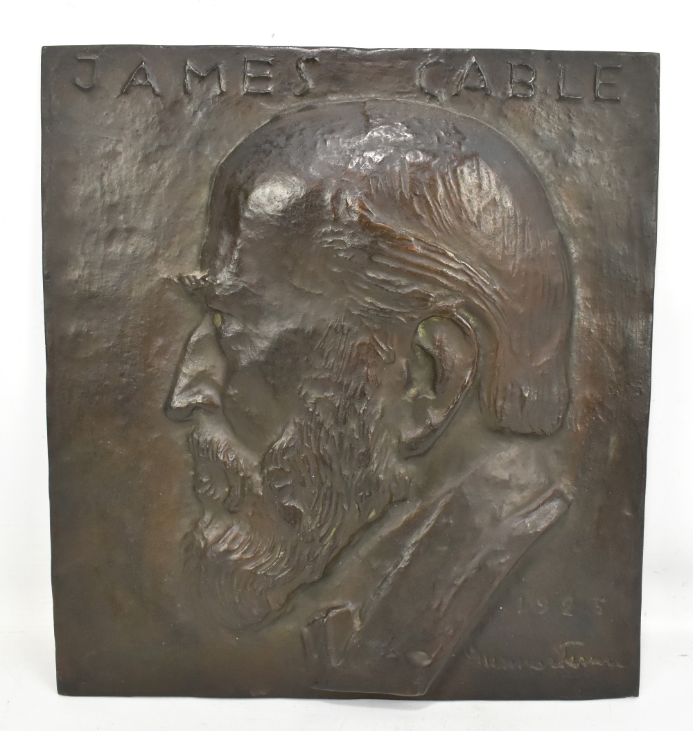 A bronze wall plaque with relief portrait bust of James Gable, indistinctly signed Gunner and