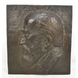 A bronze wall plaque with relief portrait bust of James Gable, indistinctly signed Gunner and