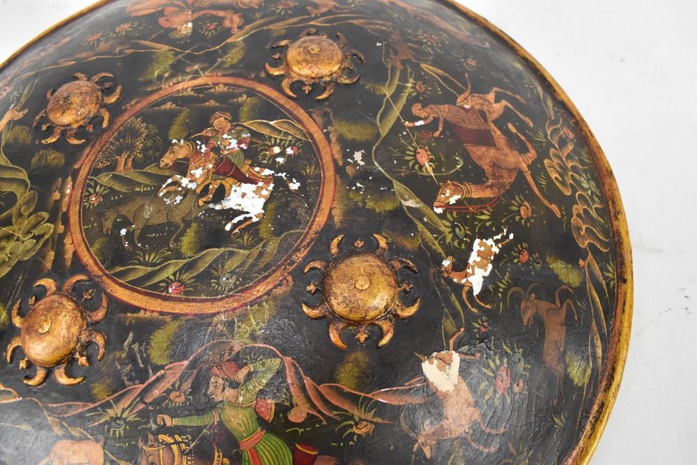 A 19th century Indian Mughal painted shield (Dhal), probably North Indian, and decorated with - Image 2 of 3