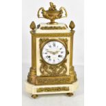 A late 19th century French white marble gilt metal mounted mantel clock, the white enamel dial set