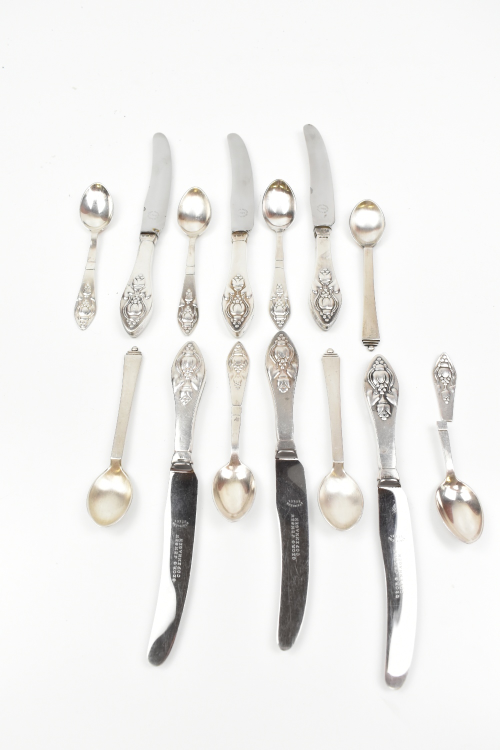 GEORG JENSEN; a set of six silver sheath handled stainless steel bladed tea knives, a set of three