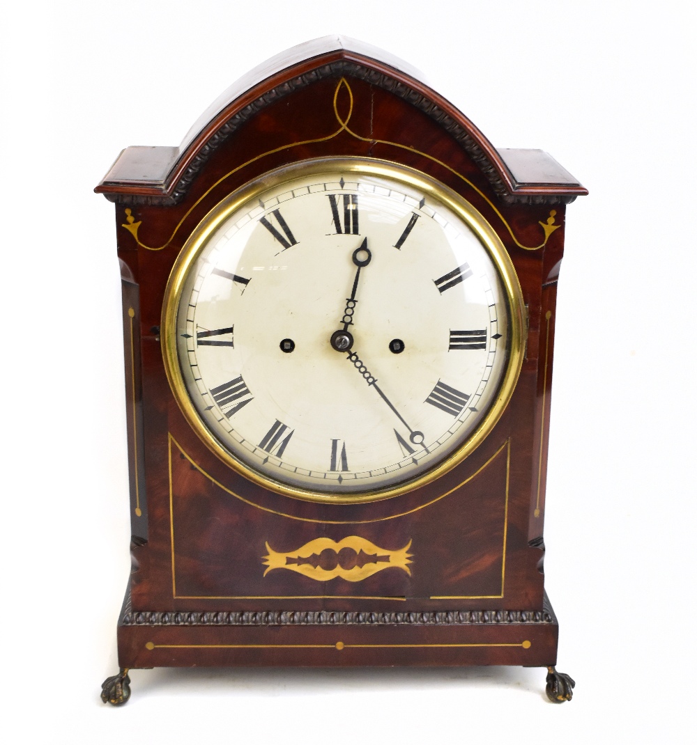 A good and large Regency mahogany brass inlaid eight day lancet shaped mantel clock, the painted