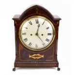 A good and large Regency mahogany brass inlaid eight day lancet shaped mantel clock, the painted