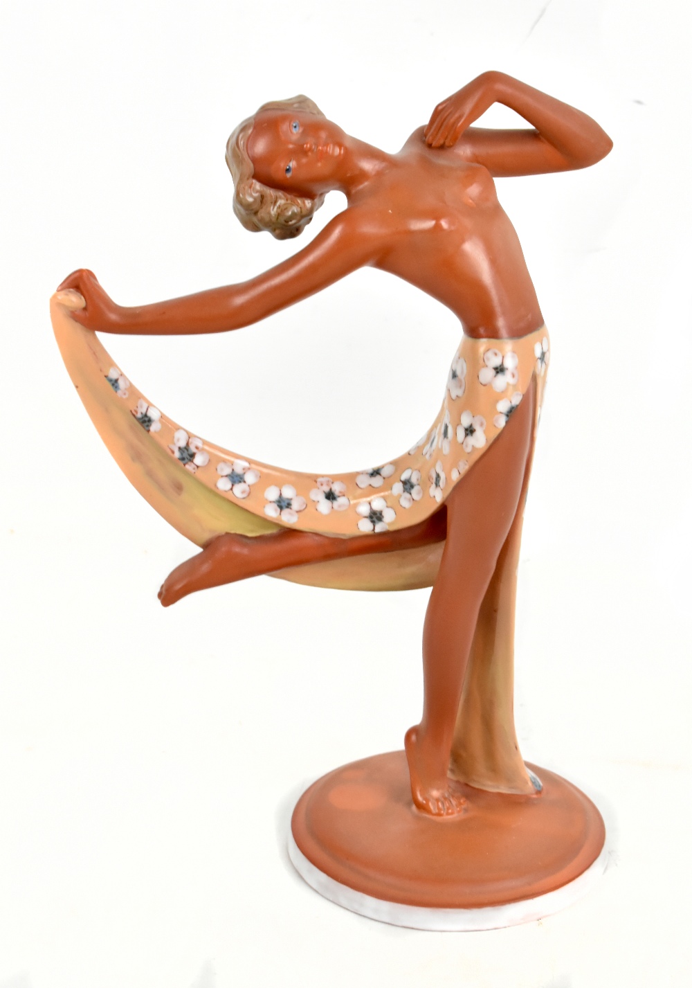 RASPER & SOHNE; an Art Deco terracotta figurine of a semi-nude girl with outswept arm, with