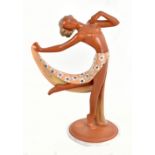 RASPER & SOHNE; an Art Deco terracotta figurine of a semi-nude girl with outswept arm, with