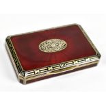 An Austro-Hungarian silver gilt and red enamelled snuff box of rectangular form with canted corners,