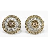 A pair of white metal target earrings, each with a central diamond weighing approx 0.15ct, approx