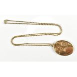 A gold oval locket suspended a yellow metal belcher link chain stamped 375 to clasp, length 56cm,