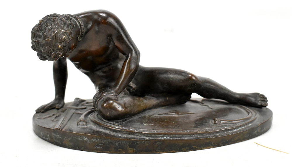 WITHDRAWN G BRANCA; a 19th century bronze figure of a nude seated soldier, signed to rim, length