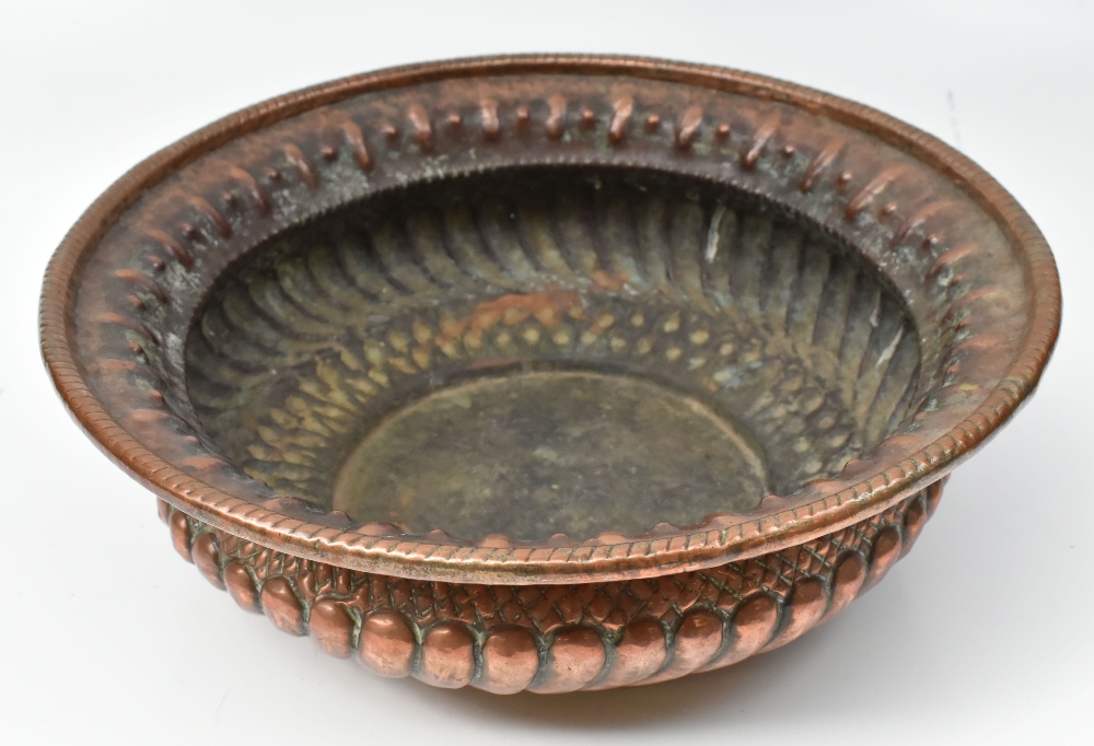 A large Eastern embossed copper bowl, diameter approx 39cm.
