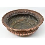 A large Eastern embossed copper bowl, diameter approx 39cm.