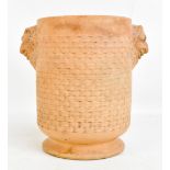 DAVENPORT; a terracotta vase with Bacchanalian moulded masks and basket weave effect to the body,