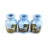 A set of three Victorian Pratt type pale blue ground grease jars, each transfer decorated with