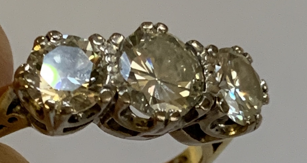 An 18ct yellow gold and diamond three stone ring, the central round brilliant cut stone weighing - Image 6 of 8